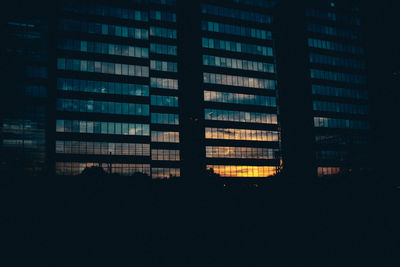 Silhouette of skyscraper at night