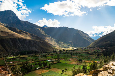 Scenic view of landscape and mountains against sky