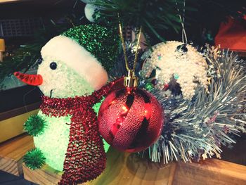 Close-up of christmas decorations hanging on tree at home