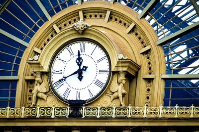 Low angle view of clock on building