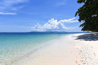 View of beach against cloudy sky