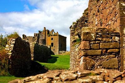 Old ruin building against cloudy sky