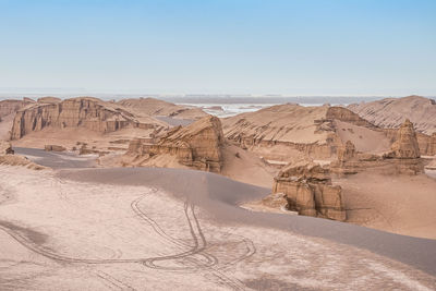 Scenic view of desert against clear sky