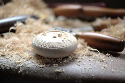 Close-up of wood shaving on table in workshop