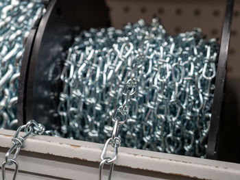 Close-up of rolled up metallic chain