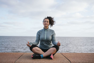 Girl meditating happy and peacefully