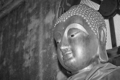 Head shot black white front left buddha statue in chinese temple at wat analayo temple