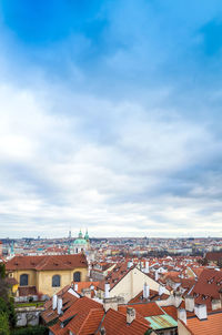 St nicholas church in city against cloudy sky