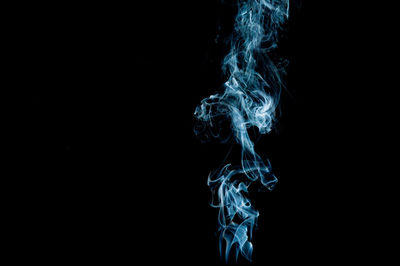 Close-up of light painting against black background