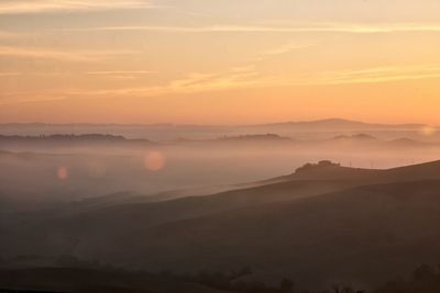 Scenic view of mountains against sky during sunset