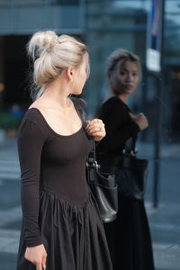 Side view of young man playing guitar