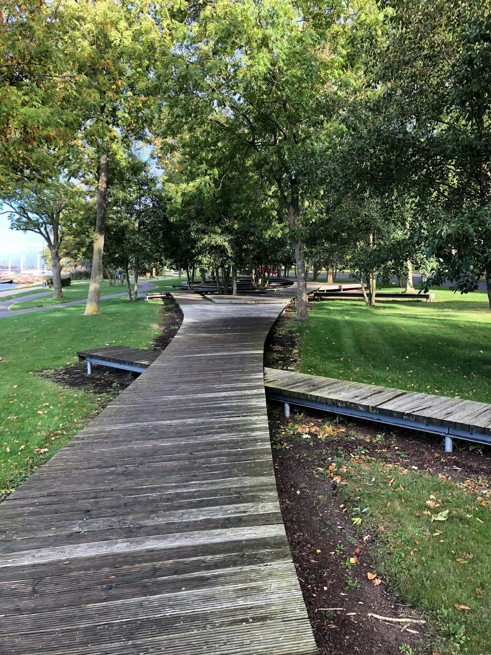 PARK BENCH ON FOOTPATH IN CITY