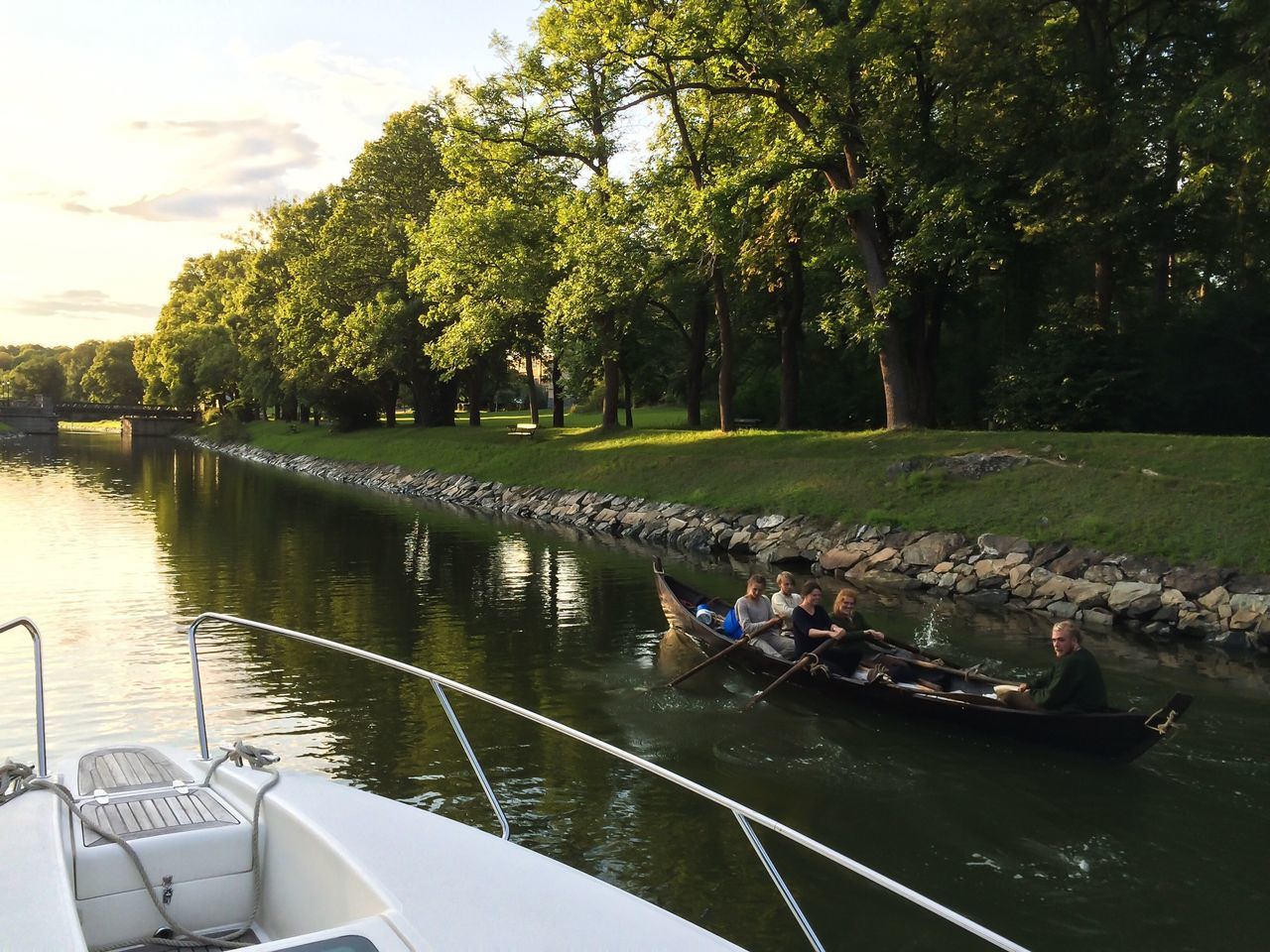 transportation, mode of transport, nautical vessel, boat, tree, water, moored, lake, river, nature, day, green color, reflection, travel, growth, sky, outdoors, tranquility, sunlight, tranquil scene