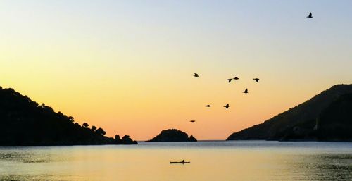 Scenic view of sea against clear sky during sunset