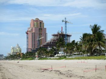 Building construction at beach against sky during sea turtle nesting season 