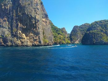 Scenic view of sea against clear blue sky