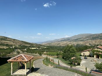 Scenic view of mountains against blue sky