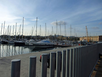 Boats moored at harbor