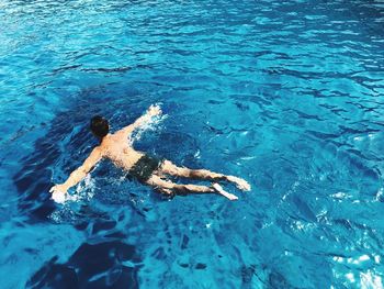 High angle view of man swimming in sea