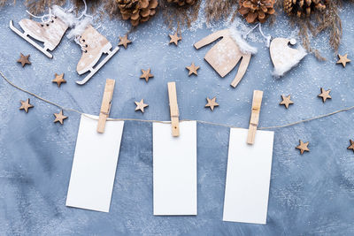 Directly above shot of blank adhesive notes with christmas decorations on table