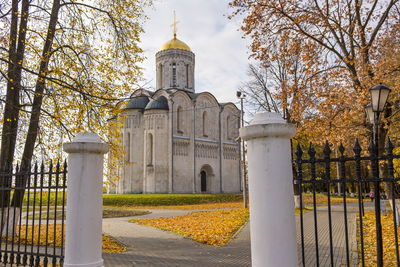 View of trees and building against sky