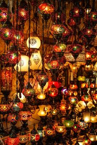 Illuminated lanterns hanging on christmas lights