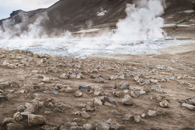 Smoke emitting from volcanic landscape