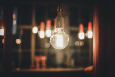 Close-up of illuminated light bulb