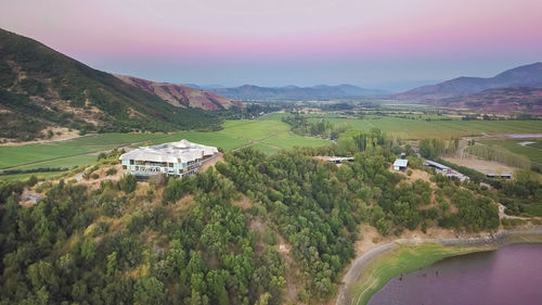 High angle view of green landscape against sky