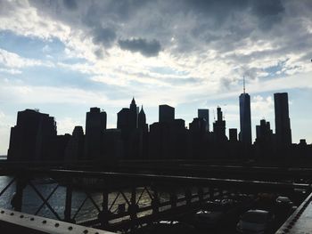 Cityscape against cloudy sky