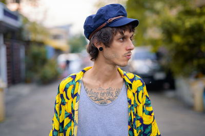 Portrait of young man looking away