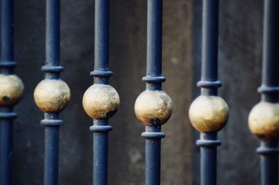 Close-up of metal railing against building