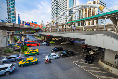 High angle view of city street and buildings against sky