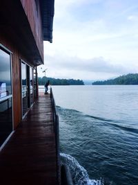 Man admiring view from boat deck