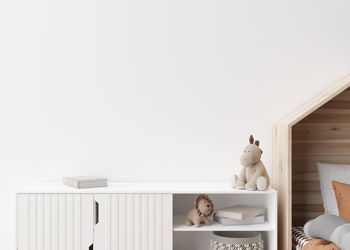 Empty white wall in modern child room. mock up interior in scandinavian style. copy space