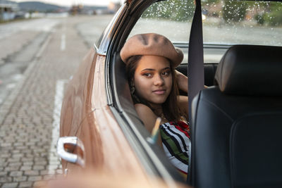 Teenage girl in car