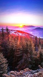 Scenic view of land against sky during sunset