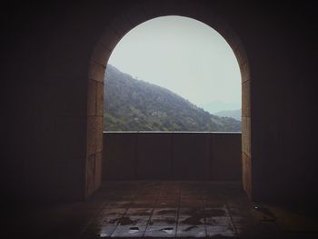 Arch against clear sky seen through archway