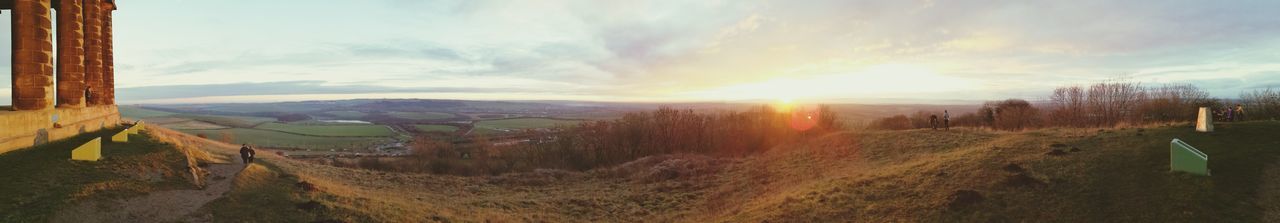 Panoramic view of landscape against cloudy sky