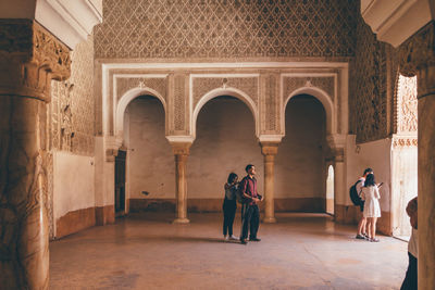 People standing in historic building