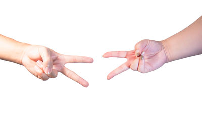 Close-up of hands over white background