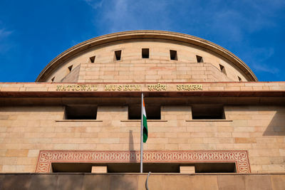 Low angle view of building against blue sky