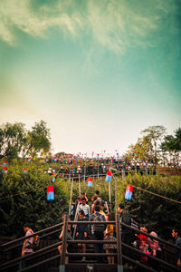 View of trees against cloudy sky