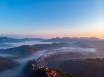 Scenic view of mountains against sky during sunset