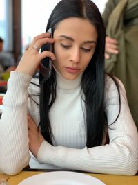 Young woman using mobile phone