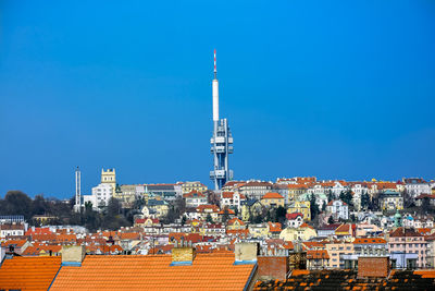 View of cityscape against blue sky