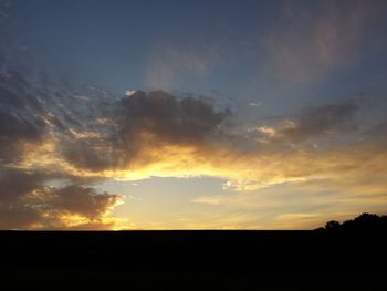 Scenic view of silhouette landscape against sky during sunset