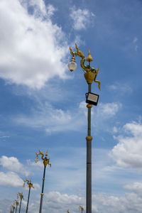 Low angle view of street light against sky