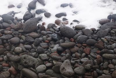 High angle view of stones on beach