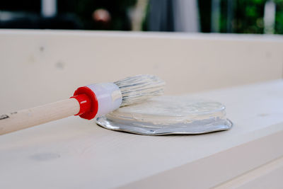Close-up of paintbrush on table